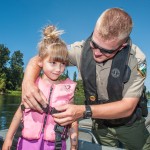 River Patrol deputy with child