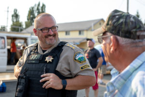 Sheriff Jim Yon speaks with citizens at a local National Night Out Event.